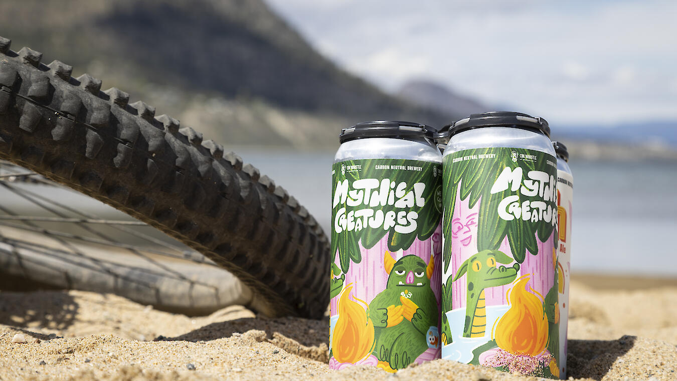 beer and mountain bike on a beach